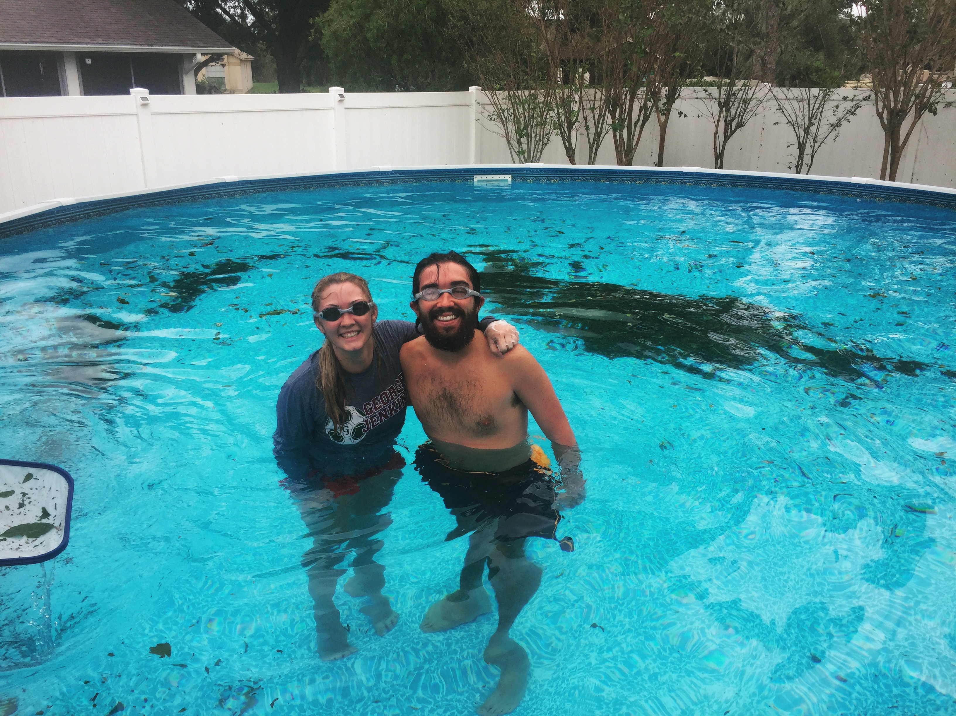 Coleman Reardon and friend cleaning up the pool